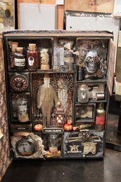 an altered cabinet with various items in it