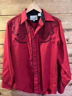 Vintage 70s 80s Roper red and black embroidered western cowboy shirt. Black pearl snaps. Thick, high quality, great condition. Beautiful embroidery! No major flaws. Smoke-free home. See pictures for measurements. Red Western Style Tops For Ranch, Western Style Red Long Sleeve Tops, Vintage Red Tops For Rodeo, Red Long Sleeve Western Top, Red Western Long Sleeve Tops, Western Embroidered Shirt For Rodeo, Cowboy Button Up Shirt, Vintage Wrangler Button Up, Vintage Red Button-up Shirt