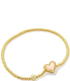 From Kendra Scott&#x2C; this bracelet features:Stretch bracelet14K gold over brass Stretch&#x2C; no closure Approx. 6.5" unstretched length Imported. Adjustable Yellow Gold Bracelet With Heart Beads, Gold Heart Stretch Bracelet For Friendship, Adjustable Gold Stretch Bracelet With Heart Charm, Elegant Gold Stretch Bracelet With Heart Beads, Gold Charm Bracelet With Heart Beads For Friendship, Gold Stackable Heart Bracelets, Gold Heart-shaped Stackable Bracelets, Gold Charm Bracelet With Heart Charm And Adjustable Fit, Gold Stackable Heart Bracelet For Valentine's Day