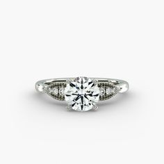 a diamond engagement ring on a white background