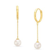 Each earring features a lustrous freshwater pearl. The delicate chain drop adds a contemporary and trendy twist to the classic huggie earring style. Elegant Gold Huggie Earrings With Pearl Charm, Classic Drop Earrings With Pearl Chain, Minimalist Formal Hoop Earrings With Pearl Drop, Formal Minimalist Hoop Earrings With Pearl Drop, Dangle Pearl Earrings With Pearl Chain, Akoya Pearl Teardrop Earrings With Pearl Chain, Elegant Sterling Silver Hoop Earrings With Adjustable Chain, Modern Akoya Pearl Drop Earrings, Dainty Drop Earrings With Pearl Chain