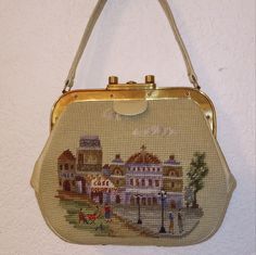 Vintage 1950s Needlepoint Purse With Parisian Scenes On Both Sides The Hardware Is Gold Tone. Handle, Frame, And Lining Are Leather. On The Inside This Vintage Beauty Has Two Open Pockets. Measurements Approx: Length: 11 Inches Height: 9 Inches Width: 3 Inches Drop Of Handle: 6 Inches Very Little Wear On This Vintage Purse Hardware Works Great There Are Scratches On The Hardware Shown In Picture Also Very Small Stains On The Bottom Please See Pictures Needlepoint Purse, Purse Hardware, Embroidered Bag, Vintage Purse, Vintage Beauty, Vintage 1950s, 11 Inches, Needlepoint, 6 Inches