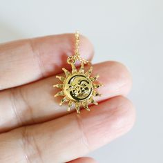 "Beautiful and lovely gold moon and sun face pendant necklace. Made of the gold plated sun and moon face pendant with a skinny gold plated brass chain. Soft and simple. Great for a gift, every day, or on a special occasion.  Your item will ship in a gift box. Please feel free to contact me if you have any questions. ♥ Length  15\" - 20\" chain ♥ Pendant  5/8\" ♥ Gold plated over brass  ♥  See more Rudiana Accessories  Rudiana.etsy.com" Gift Moon And Sun Design Necklaces, Sun And Moon Design Necklace As Gift, Sun And Moon Design Necklace For Gift, Handmade Gold Celestial Charm Necklaces, Gold Celestial Handmade Charm Necklace, Handmade Gold Celestial Charm Necklace, Spiritual Gold Charm Necklace With Moon Charm, Gold Moon Charm Necklace With Sun And Moon Design, Yellow Gold Charm Necklaces With Sun And Moon Design