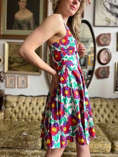 Description: Expertly designed with a vintage-inspired fit and flare silhouette, this 80s era dress boasts a unique and eye-catching floral pattern. Made with quality materials, this dress is sure to make a statement at any event. Available in size M. Size: M Bust: 32” Waist: 27” Condition: excellent Label: Allison Blair Material: 100% Cotton Era: 80s does 50s This is a preloved item. A-line Dress With Vintage Print For Vintage Fashion, Vintage Style Summer Midi Dresses, Vintage A-line Midi Dress For Spring, Vintage Style Midi Length Summer Dresses, Retro Vintage Midi Length Dress For Garden Party, Retro Dress With Vintage Pattern For Garden Party, Retro Summer Midi Dress With Fitted Bodice, Fitted Vintage Dress For Retro-themed Summer Events, Spring Vintage Midi Dress With Floral Print