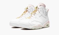 The Women’s Air Jordan 6 “Gold Hoops” is a women’s-only colorway of Michael Jordan’s sixth signature shoe that excels in versatility due to its neutral design.  Ideal for the summer months, the “Gold Hoops” displays luxurious gold accenting on various points of its design, specifically on the Jumpman-branded lace toggle, on the spoiler, and on the gold hoop earring-inspired Jumpman hang tag.  Crisp white leather overlays contrast the Sail-colored base.  Gold “Jordan” detailing can be found on th British Khaki, Popular Sneakers, Neutral Design, Air Jordan 6, Stadium Goods, Jordan 6, University Blue, Womens Basketball, Mens Basketball