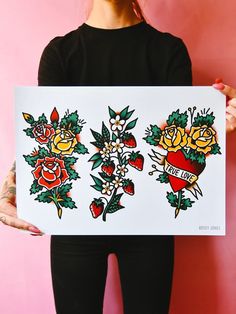 a woman holding up a piece of art with roses and hearts on it in front of a pink wall