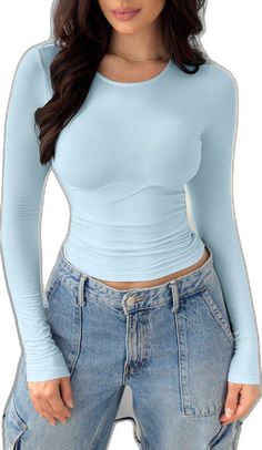 High Stretch Blue Winter Top, Light Blue Long Sleeve Tops For Fall, Light Blue Crew Neck Winter Top, Light Blue Long Sleeve Solid Color Top, Light Blue Long Sleeve Solid Top, Light Blue Stretch Tops With Solid Color, Fitted Light Blue Winter Tops, Light Blue Fitted Tops For Fall, Fitted Light Blue Top For Winter