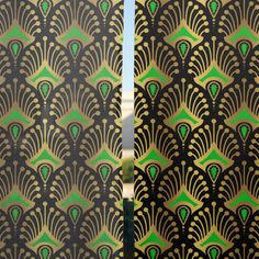 an art deco wallpaper with green and gold designs