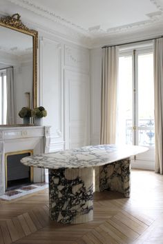 an elegant dining table in the middle of a room