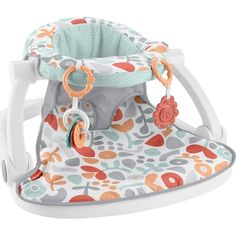 a baby's swing that is in the shape of a chair with flowers on it