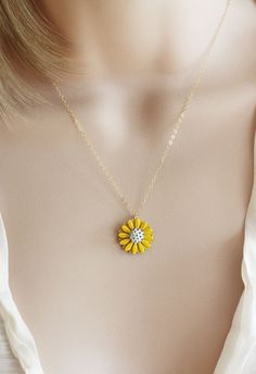 "This pendant is from my vintage garden collection, sweet adorable tiny yellow enamel daisy measures 50\" in diameter. Hangs from a new 14 karat gold filled cable chain . Spring closure clasp. The Daisy is vintage an in mint condition The model is wearing a 16\" length. H A N D M A D E * We hand make all pieces in our Water Mill New York studio * We source eco friendly packaging and materials, including recyclable mailers! FREE BOX AND WRAP ON EVERY ORDER P R O D U C T I O N ∙ T I M E S All item Dainty Yellow Flower Shaped Jewelry, Yellow Flower Shaped Jewelry With Adjustable Chain, Dainty Yellow Gold Charm Necklace With Flower Shape, Vintage Gold Jewelry With Sunflower Design, Yellow Flower Necklaces For Jewelry Making, Yellow Daisy Shaped Jewelry Gift, Yellow Daisy-shaped Jewelry Gift, Yellow Dainty Jewelry With Adjustable Chain, Yellow Necklace With Birth Flower Pendant