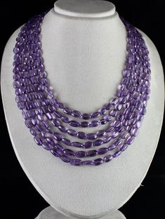 PRODUCT DETAILS LINE 6/CTS 962 NATURAL AMETHYST LONG TUMBLE BEADS   ULTIMATE RARE SIZE  NATURAL BEADS SIZES OF THE BEADS ARE FROM 15 MM TO 10 MM  LENGTH OF THE NECKLACE IS 18 INCHES  OUTER LENGTH OF THE NECKLACE IS 22 INCHES ATTACHED TO SIZABLE SILK CORD FINE PURPLE COLOR BEST LOWEST PRICE OFFERED NOTE - #You will receive the same product you see in picture. #DEAR BUYERS PLEASE FEEL FREE TO ASK QUESTIONS  #WE WILL BE GLAD TO ANSWER & SOLVE QUERY REGARDING THIS PRODUCTS #RETURN POLICY Every piece Amethyst Beaded Necklace, Elegant Oval Beaded Stone Necklaces, Elegant Beaded Necklaces With Stones, Elegant Beaded Necklaces With Oval Stones, Elegant Single Strand Amethyst Beaded Necklace, Luxury Purple Necklaces With Faceted Beads, Luxury Single Strand Amethyst Beaded Necklace, Luxury Amethyst Multi-stone Necklace, Elegant Purple Faceted Beads