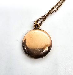 Gold filled etched locket mid century photo necklace. Good used condition with little to no signs of normal wear. Chain has early thumb clasp. Etched with the number 16 on the inside of each side of locket. Comes with vintage picture and frame. Necklace measures 15.5 inches long. Locket measures 5/8ths of an inch across. Vintage Antique Gold Keepsake Necklace, Antique Pendant Locket Necklace With Vintage Charm, Vintage Locket Necklace With Large Pendant For Gift, Antique Medallion Necklace With Locket, Antique Gold Medallion Locket Necklace With Vintage Charm, Vintage Medallion Locket Necklace As Gift, Antique Medallion Locket Necklace, Vintage Locket Pendant Jewelry, Round Brass Locket Necklace With Vintage Charm