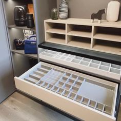 two open drawers in the middle of a room