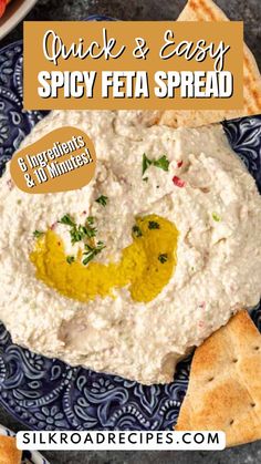 a bowl of dip with crackers and pita bread on the side for an easy appetizer