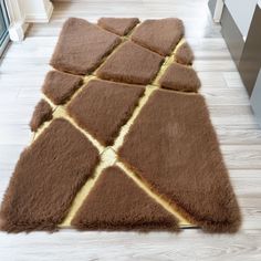 a brown area rug on the floor in a room