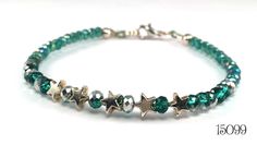 Petite shiny silver tone stars alternating with 4 mm rondelle crystals that are half peacock green and half silver.  The sides of the bracelet are a string of six more half green/half silver rondelles, then a longer string of 3 mm sparkly faceted peacock green rondelle crystals. This beaded bracelet is strung on a heavier gauge wire that holds it shape, similar to a bangle. Lobster claw clasp Length:  17.7 cm / 7 inches Item # 15099 Peacock Green, Shiny Silver, Silver Stars, Friendship Bracelet, Friendship Bracelets, Silver Tone, Jewelry Bracelets, Bangles, Beaded Bracelets