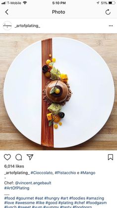 a white plate topped with food on top of a wooden table