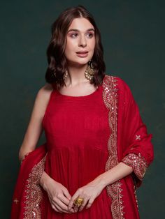 Elevate your festive wardrobe with our stunning red georgette festival wear gown. This exquisite gown is designed to make you stand out at any celebration, combining traditional elegance with modern sophistication. The rich red color is perfect for making a bold statement, ensuring that you are the center of attention at festivals, functions, and special events.
Crafted from high-quality georgette fabric, the gown offers a luxurious feel and a flattering drape. The accompanying dupatta is equall Red Anarkali Style Sharara In Chinon, Red Anarkali Sharara For Reception, Red Anarkali Set For Reception And Eid, Designer Red Sharara In Chinon, Red Floor-length Anarkali Set With Dupatta, Red Kurta With Sheer Dupatta For Wedding, Wedding Red Kurta With Sheer Dupatta, Red Anarkali Set With Dupatta For Reception, Red Traditional Drape Party Dress