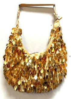 Sequin Handbags  are   hand-made, high quality, original designs, and beautiful. They are unique for evenings and special events and their designs are inspired by contemporary fashion and vintage looks. Sequin handbags are a perfect balance of aesthetics and functionality. Size: 1"x8" Large Gold Hobo Shoulder Bag For Party, Trendy Hobo Bag For Party, Trendy Hobo Shoulder Bag For Party, Trendy Party Hobo Bag Tote, Chic Hobo Shoulder Bag For Party, Gold Satchel Bag For Party, Evening Tote Shoulder Bag, Gold Hobo Bag For Evening, Chic Pouch-shaped Hobo Bag For Gift