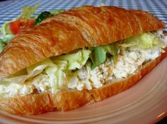 a croissant sandwich with chicken salad on it