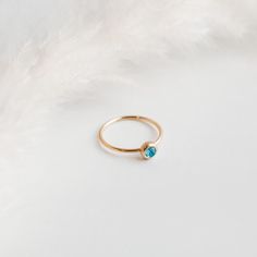 This listing is for a beautiful birthstone ring, crafted from high-quality metal and gemstone that represents the wearer's birth month. Each birthstone is associated with specific qualities, making this ring a meaningful and personal accessory. The ring features a simple yet elegant design that showcases the gemstone. Whether worn as a daily reminder of one's special qualities, or given as a sentimental gift, this birthstone ring is a timeless and cherished accessory. Choose your birth month and Minimalist Topaz Birthstone Ring As Gift, Topaz Birthstone Ring Gift, Topaz Birthstone Ring For Gift With Round Band, Dainty Crystal Ring With Birthstone For Promise, Dainty Crystal Birthstone Ring For Promise, Topaz Birthstone Ring As Gift With Round Band, Dainty Topaz Birthstone Promise Ring, Dainty Birthstone Crystal Ring, Dainty Blue Topaz Promise Ring