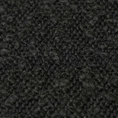 the texture of an upholstered black carpet