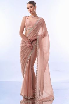 Elevate your festive wardrobe with this exquisite Designer Saree. Crafted from premium fancy fabric, this saree features intricate designer work lace border that beautifully complements the luxurious Art Silk blouse. The highlight of this ensemble is the stunning Swarovski work that adds a touch of opulence and sparkle, making it perfect for any festive occasion. Whether it's a grand celebration or an intimate gathering, this saree promises to make you shine with its elegant and sophisticated de Silk Saree New Collection, Work Sarees Blouse Designs, Shapewear For Saree, Plain Saree With Lace Border, Sarees For Festival, Farewell Saree Blouse Designs, Pestal Colour Sarees, Peach Blouse Design, Elegant Saree Blouse Designs