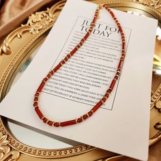 This Carnelian necklace, Beaded gemstone necklace, Red agate necklace, Red gemstone necklace, Healing jewelry, Energy stone necklace is classic and beautiful. It is made with 4mm carnelian round beads and 4×13mm carnelian tube beads with 18k gold (vacuum-plated on stainless steel) spacer beads.  Carnelian, with its warm, reddish hues, is a semi-precious stone prized for its beauty and historical significance. Used in ancient times for seals and amulets, it's believed to provide courage and vital Adjustable Red Crystal Necklaces With Colorful Beads, Adjustable Red Crystal Necklace With Colorful Beads, Red Long Beaded Necklaces For Gifts, Adjustable Red Crystal Necklaces, Red Crystal Necklaces With Colorful Round Beads, Red Beaded Agate Jewelry, Red Gemstone Beads Long Necklace, Red Gemstone Beaded Long Necklace, Red Agate Beaded Jewelry