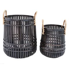 two black wicker baskets sitting side by side on a white background with twine handles