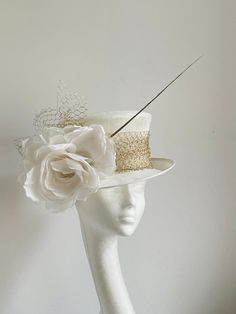 Ivory white gold hat This amazing ivory white gold hat is made from ivory colour sinamay fabric. On the side is sitting silk flower and gold netting and a gold feather. the hat will be an amazing accessory to compliment your outfit. It will fit the average head size 54-55cm You can wear this amazing hat at the wedding, Christening, Royal Ascot races, and any other special occasion. Enjoy and please have a look at my hats and fascinators in my shop  https://www.etsy.com/uk/shop/KristineRosahats?r White Adjustable Top Hat With Short Brim, Adjustable White Top Hat With Short Brim, White Fitted Top Hat With High Crown, Elegant Fitted Costume Hat With Tall Crown, Cream Short Brim Top Hat For Formal Occasions, Gold Top Hat With Short Brim For Kentucky Derby, Gold Costume Hats For Kentucky Derby With Short Brim, Gold Costume Hat With Short Brim For Kentucky Derby, White Structured Crown Hat For Kentucky Derby