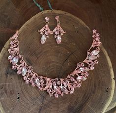 "Pink necklace set Beautiful blush pink teardrop cluster crystal rhinestone necklace and earrings set are a great statement piece! Prom, pageant, or Bridal! Or an evening out! Size of earrings: 2\" Long. Necklace 15\"long with 3\" chain extender Decor Size: 1.25\" Color: rose pink / blush Base metal color: gold More colors available upon request, just message us! Need a matching bracelet? https://www.etsy.com/listing/1196317789/pink-rose-gold-bracelet-wide-pink?click_key=faa6b911fdc3999350154ef3d4844864e7cac6b7%3A1196317789&click_sum=15c68f94&ga_search_query=pink&ref=shop_items_search_37&pro=1&frs=1&sts=1 https://www.etsy.com/listing/690752461/pink-bracelet-rose-pink-bracelet-rose?ref=shop_home_active_14 https://www.etsy.com/listing/661759254/pink-bracelet-pink-rhinestone-bracelet?ref=shop Light Pink Jewelry Set, Pink Prom Accessories, Pastel Pink Bridesmaid, Pink Necklace Jewelry, Light Pink Necklace, Pink Necklace Set, Light Pink Jewelry, Prom Jewellery, Light Pink Crystal