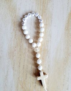 New to our collection, a mini version of our personalized rosary!  These beautiful rosaries are handmade and are perfect for any religious occasion, baptism, first communion, confirmation etc. You can buy 1 or many!  Each rosary is made using gemstone beads, glass beads and a howlite cross. White Rosary Bracelet For First Communion, Personalized Spiritual Rosary Gift, Adjustable White Rosary For First Communion, Customizable White Rosary Bracelet As A Gift, Customizable White Rosary Bracelet As Gift, Customizable White Rosary Bracelet Gift, White Cross Rosary Bracelet For First Communion, Spiritual Cross Rosary Bracelet For Baptism, White Rosary With 8mm Beads As Gift