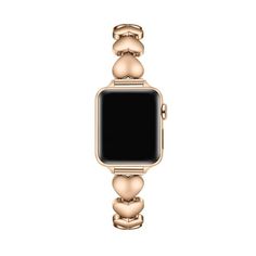 an apple watch with gold bracelets and a black screen on the front, against a white background