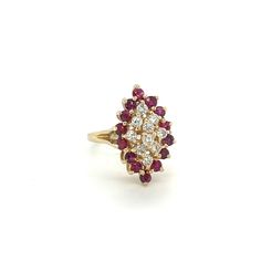 This stunning Estate Ruby and Diamond Cluster Ring features a dazzling cluster of diamonds surrounded by rubies, set in 14k yellow gold. The traditional design of this statement ring adds a unique, polished touch to any outfit. Estate Ruby and Diamond Cluster Ring at Regard Jewelry in Austin, Texas Classic Ruby Ring With Rose Cut Diamond Cluster, Formal Ruby Ring With Diamond Accents In Cluster Shape, Formal Cluster Ruby Ring With Diamond Accents, Cluster Ruby Ring With Rose Cut Diamonds, Cluster Ruby Diamond Ring With Center Stone, Cluster Ruby Ring With Brilliant Cut Diamonds, Ruby Ring With Diamond Cluster And Brilliant Cut, Formal Cluster Ruby Ring, Marquise Ruby And Diamond Multi-stone Ring