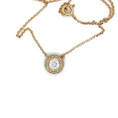 This 18 karat yellow gold bezel and pave set pendant has a .50 carat GIA# 2195570029 .50 carat round center stone graded I in color and SI2 in clarity with a very good cut. It is surrounded by .44 carats of round brilliant stones pave set and graded H in color and SI1 in clarity. The chain is a classic cable at it is 16 inches in length. 9.15 mm in diamter and the total Diamond weight is .94 carats. Bezel Pendant, Cut It, Bezel Diamond, Round Brilliant, Round Diamond, Round Diamonds, Jewelry Design, Cable, Yellow Gold