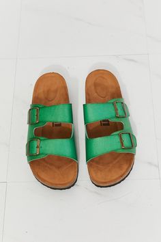 Add a pop of color to your summer look with these buckled slide sandals! Their comfortable design will keep you on your feet. while the adjustable straps allow you to tailor their fit and keep them secure all day. Wear as an everyday shoe all summer long with jeans. denim shorts. or biker shorts! Size fit: True to size Pattern type: Solid Type: Slides Toe: Open toe Heel height: Flats Heel shape: Flats Material: PU leather /Cork sole Imported Product measurements: Heel height: 1 inchLuis Shophas made a name for itself in European and Asian markets through footwear trade shows. In 2021. Luis Shopstarted its journey to the US market. All products are crafted with high-quality materials and designs that have been well-received in European and Asian markets. Luis Shopaims to provide fashionable Adjustable Strap Slip-on Footbed Sandals For Vacation, Spring Slides With Rectangular Buckle Closure, Beach Slip-on Footbed Sandals With Buckle Closure, Slip-on Footbed Sandals With Adjustable Strap For Beach, Beach Buckle Closure Slip-on Footbed Sandals, Green Open Toe Footbed Sandals With Buckle Closure, Flat Beach Slides With Buckle Closure, Green Sandals With Adjustable Strap, Trendy Double Strap Footbed Sandals For Beach