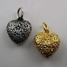 "This sterling silver, two-sided Solid Puffy Heart Charm Number 75 (Floral Heart) features a repeating design of flowers.Marked, Sterling. Made by Brown County Silver. Vintage and in new, never worn condition. Approximately 30 years old. Available in sterling silver and sterling silver with 14k gold vermeil. 3/4\" high with jump ring. 1/2\" wide 2.4 grams approx. *Chain not included See more @ https://www.etsy.com/shop/brocosi" Silver Heart Necklace With Charms For Valentine's Day, Silver Heart Necklace With Heart Beads, Silver Open Heart Necklace With Charms, Silver Double Heart Necklace With Heart Beads, Handmade Silver Heart Necklace, Handmade Silver Double Heart Necklace, Puffy Heart Charms, Brown County, Hearts Valentines