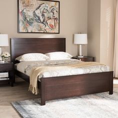 a bedroom with a bed, nightstands and painting on the wall above it's headboard