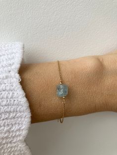 "A beautiful crystal is combined with a dainty chain to create this bracelet. Aquamarine is also the birthstone of anyone born in the month of March. D E T A I L S  *It features a raw aquamarine nugget. Each of these is unique and measures between 6 and 8mm. *It has been wire wrapped to a dainty stainless steel chain. This  available in 14k gold, silver and rose gold. *Stainless steel does not tarnish or oxidise and is also amazingly hypoallergenic. *Bracelet comes with a matching crystal card a Everyday Dainty Birthstone Crystal Bracelet, Aquamarine Bracelet Jewelry As A Gift, Dainty Aquamarine Gold Jewelry, Minimalist Gold Aquamarine Jewelry, Dainty Everyday Crystal Birthstone Bracelet, Minimalist Aquamarine Jewelry For Gift, Minimalist Aquamarine Jewelry Gift, Aquamarine Bracelet Jewelry Gift, Rose Gold Aquamarine Gemstone Jewelry