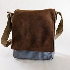 "Messenger Bags For Men, Vegan Crossbody Bags,Brown & Light Blue Laptop Bag, Cool Computer Bag, Male Shoulder Bag, Canvas Messenger Bag, Unisex Vegan Bags The Vegan Canvas bag has a funky design, unique colors combination and durable materials. ** USAGE ** Large unisex bag, a classic one for students. suitable for books, documents, laptop and more. The College bag can be used diagonally or on the shoulder. ** SPECIFICATIONS ** Features: + Wide adjustable shoulder strap to fit any height. + Separ Canvas Shoulder Bag With Cell Phone Pocket, Blue Bag With Adjustable Strap, Rectangular Canvas Bag With Cell Phone Pocket, Canvas Crossbody Bag With Cell Phone Pocket, Waxed Canvas Crossbody Bag For On-the-go, Waxed Canvas Shoulder Bag With Pockets, Blue Canvas Backpack For Everyday Use, Rectangular Canvas Shoulder Bag With Cell Phone Pocket, Blue Waxed Canvas Bag For Daily Use