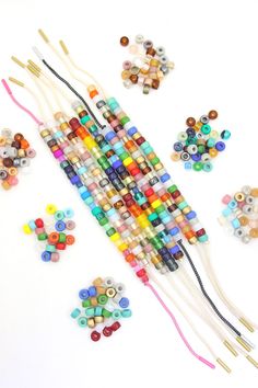 the beads are being made with different colors and sizes, including multi - colored beads