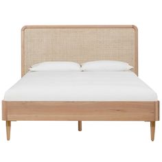 the headboard and foot board are made from natural wood, with white linens