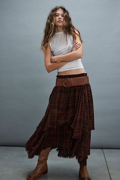 Perfect in plaid, this quintessentially FP maxi skirt will be your go-to all season long. **Fit:** Mid-rise, billowy tiered fit **Features:** Elastic waistband for pull-on ease, plaid print throughout, asymmetrical tiered hemline, raw-edge seaming throughout **Why We ❤ It:** Toughened-up with moto boots or sleek with kitten heels, this style has endless ways to wear. | FP One Averie Maxi Skirt at Free People in Brown, Size: S Boho Skirt Outfit, Mid Skirt Outfits, Magic Skirt, Long Plaid Skirt, Brown Maxi Skirts, Flannel Skirt, Bohemian Skirt, Maxi Skirt Outfits, Maxi Skirt Boho