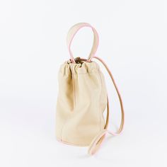 Soft leather bucket bag. Carry by the short handle or switch it out for a long shoulder strap. Puff Bag, Leather Bucket Bag, Leather Bucket, Painting Edges, Cashew, Italian Leather, Drawstring Backpack, Soft Leather, Solid Brass