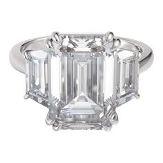 Introducing the epitome of luxury: our 4.20 carat emerald cut diamond ring. Certified by the renowned Gemological Institute of America (GIA), this masterpiece boasts, F color and dazzling VS2 clarity. Meticulously set in solid 18 carats white gold Designed to captivate and enchant, the emerald cut offers a unique allure, showcasing the diamond's exceptional clarity and captivating sparkle with every movement. Whether celebrating a momentous occasion or expressing everlasting love, this exquisite 5 Carat Diamond Ring, Three Diamond Ring, Emerald Cut Diamond Ring, Stone Diamond Ring, Three Stone Diamond Ring, Emerald Cut Rings, Three Stone Diamond, Emerald Cut Diamond, Diamond Ring Settings