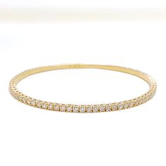 Indulge in the ultimate luxury with our Classy Striking Diamond Bangle Bracelet. Crafted with 18k Yellow Gold and adorned with 1.93ct round brilliant cut diamonds in F-G color and VS quality, this bangle bracelet is a timeless piece that will elevate any outfit. With a weight of 8.1 grams, it features a push lock that makes it easy to wear and take off. Add this exquisite piece to your jewelry collection today. PRODUCT DETAILS Gold Purity(karat): 18k Item Weight(grams): 8.1 Item Finish: Yellow G 18k Gold Bangle, Diamond Bangle Bracelet, Diamond Bangles Bracelet, Gold Bangle Bracelet, Gold Bangle, Diamond Bangle, Round Brilliant Cut Diamond, Gold Bangles, Round Brilliant