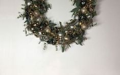 a christmas wreath is hanging on the wall