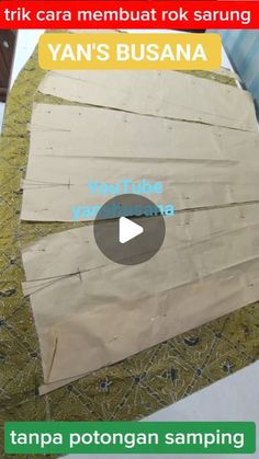 the video shows how to make a paper boat out of wood strips and cardboard with yarn