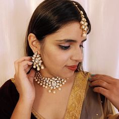 Exotic and snag-free kundan beaded necklace set with earrings. This is a stylish set with White Kundan. This set will work well with traditional, formal, and western formals. Eye-catching and unique jewelry that will set you apart. Gift this piece to a loved one, and see their face light up with joy. Best for gifting or for personal use, wear it to any occasion and become the spotlight. White color : R133C1445D418 SKU Kundan Jewelry Sets With Cutdana, Elegant Kundan Necklace With Stone Work For Navratri, Formal Chandbali Kundan Necklace With Meenakari, Formal Bollywood Chandbali Jewelry Sets, Temple Style Formal Kundan Necklace, Formal Kundan Jewelry Sets Chandbali Style, Formal Kundan Jewelry Sets With Chandbali Design, Kundan Necklace For Party, Kundan Party Necklace